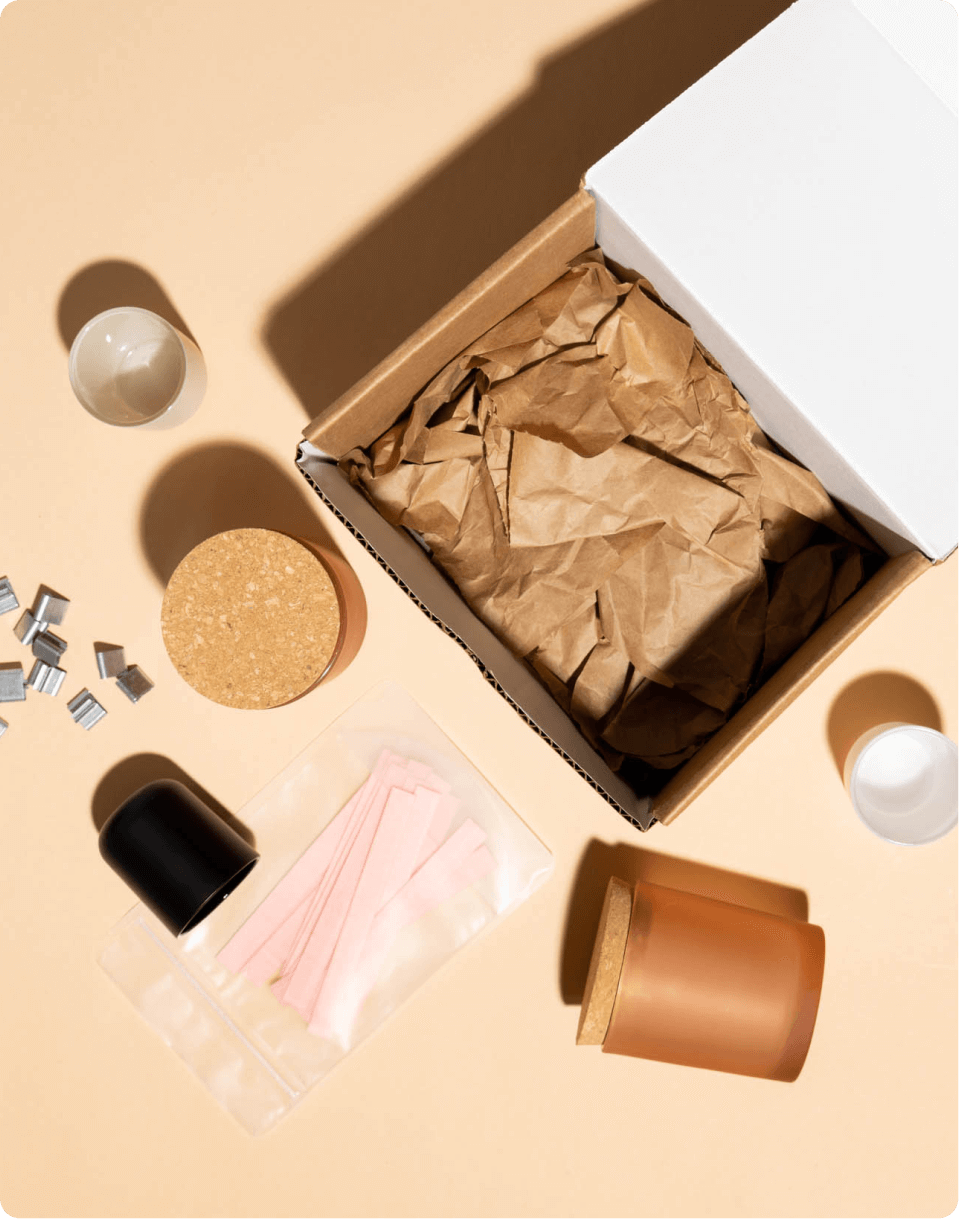 box showing wick clips, candle vessels, candle wicks, and candle vessels