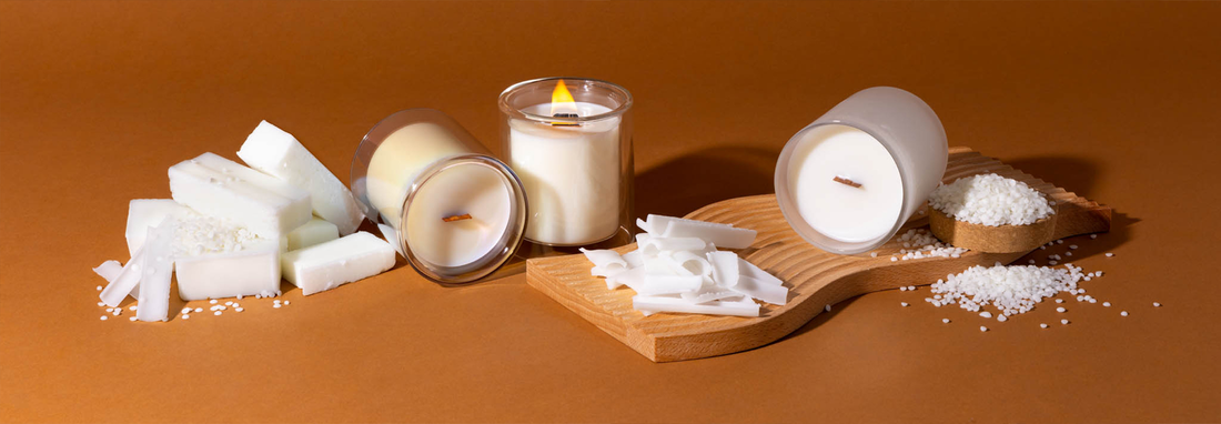 Soy wax, beeswax, and paraffin wax samples with handmade candles, comparing candle wax types for candle making and performance.