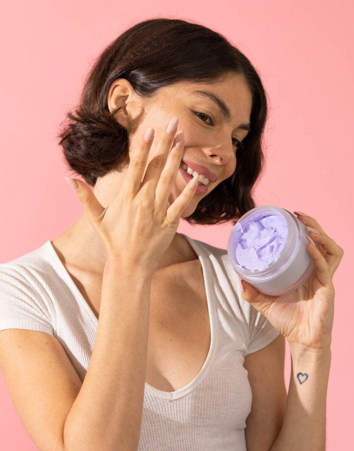 a woman applying DIY face scrub 
