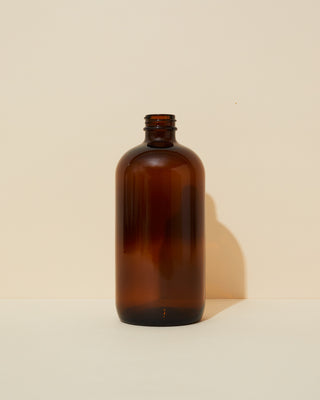 16 oz / 473 ml translucent amber boston round glass bottle