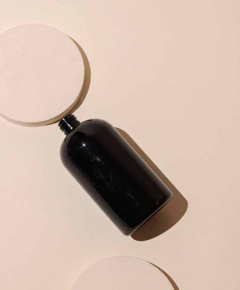 16 oz / 473 ml gloss black boston round pet bottle